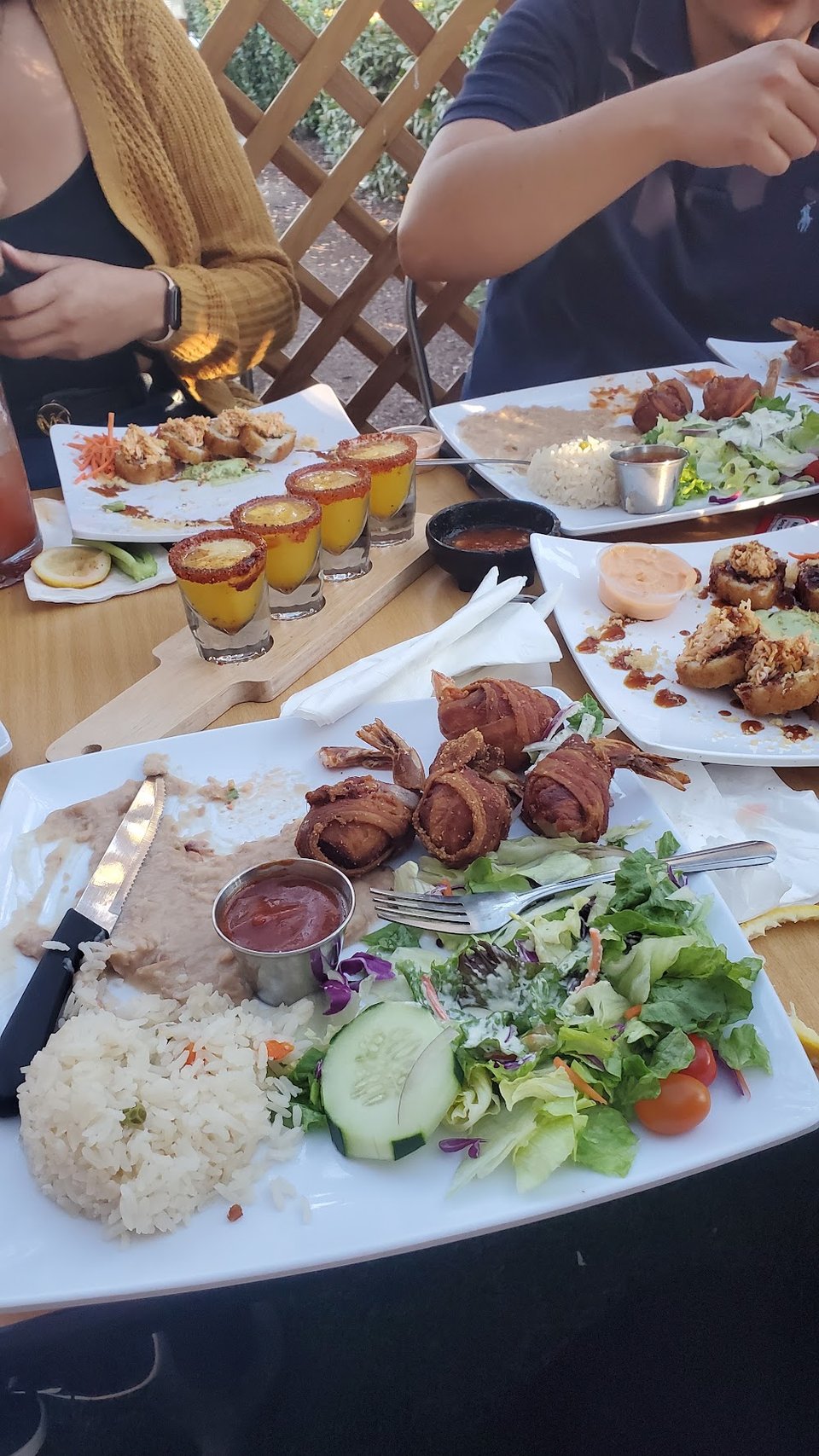 Restaurant menu with platters and rolls.