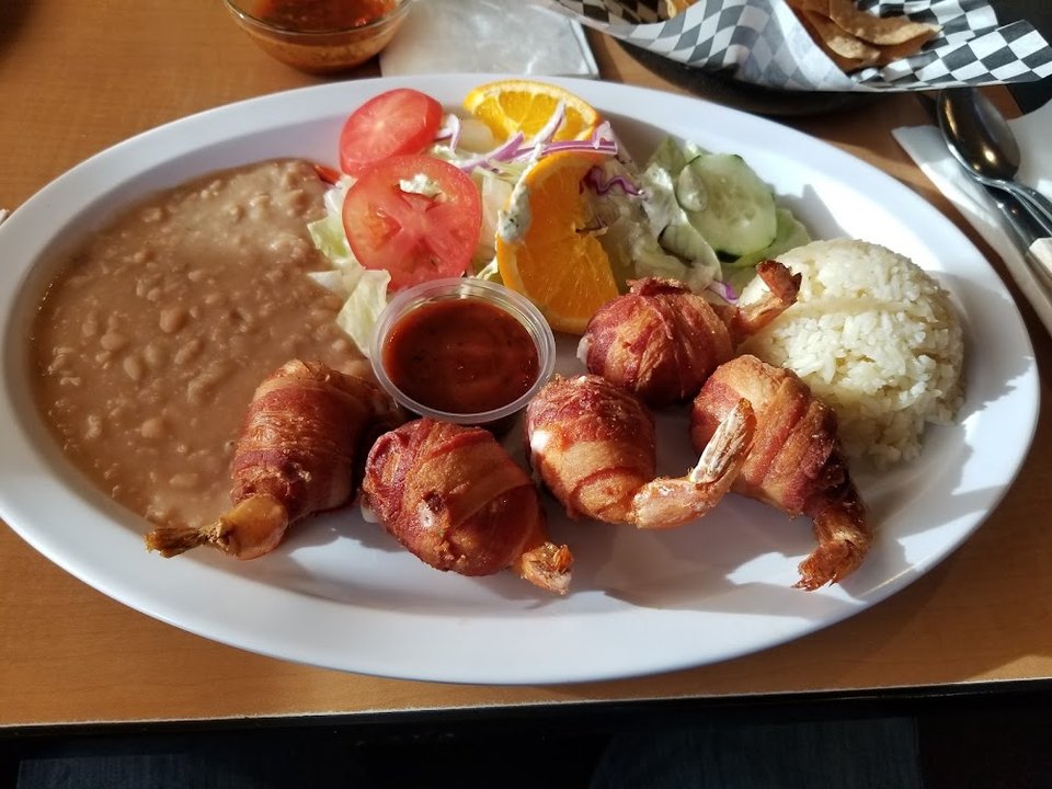 Printed menu with seafood and Mexican dishes.