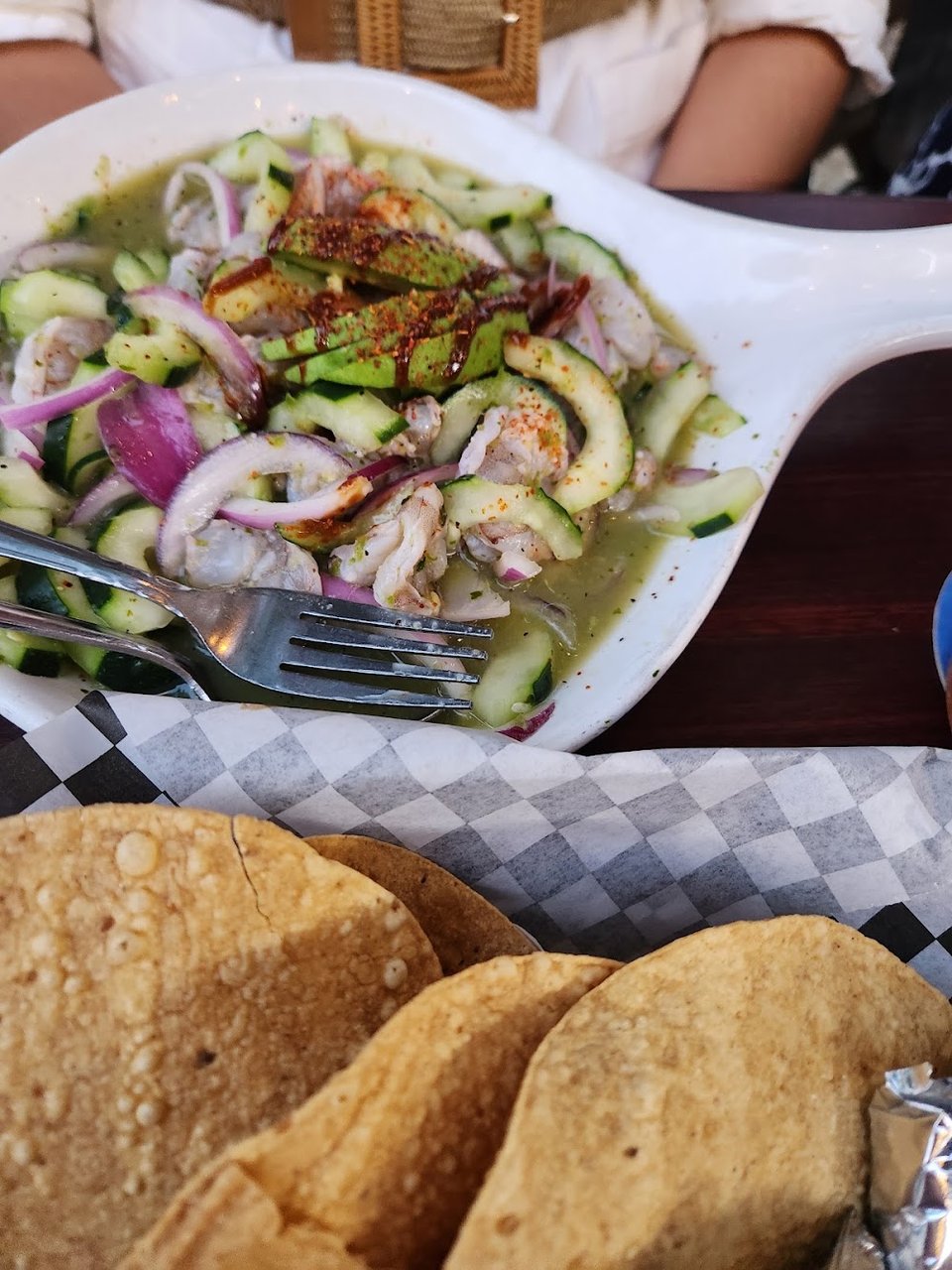Printed menu with seafood and Mexican dishes.
